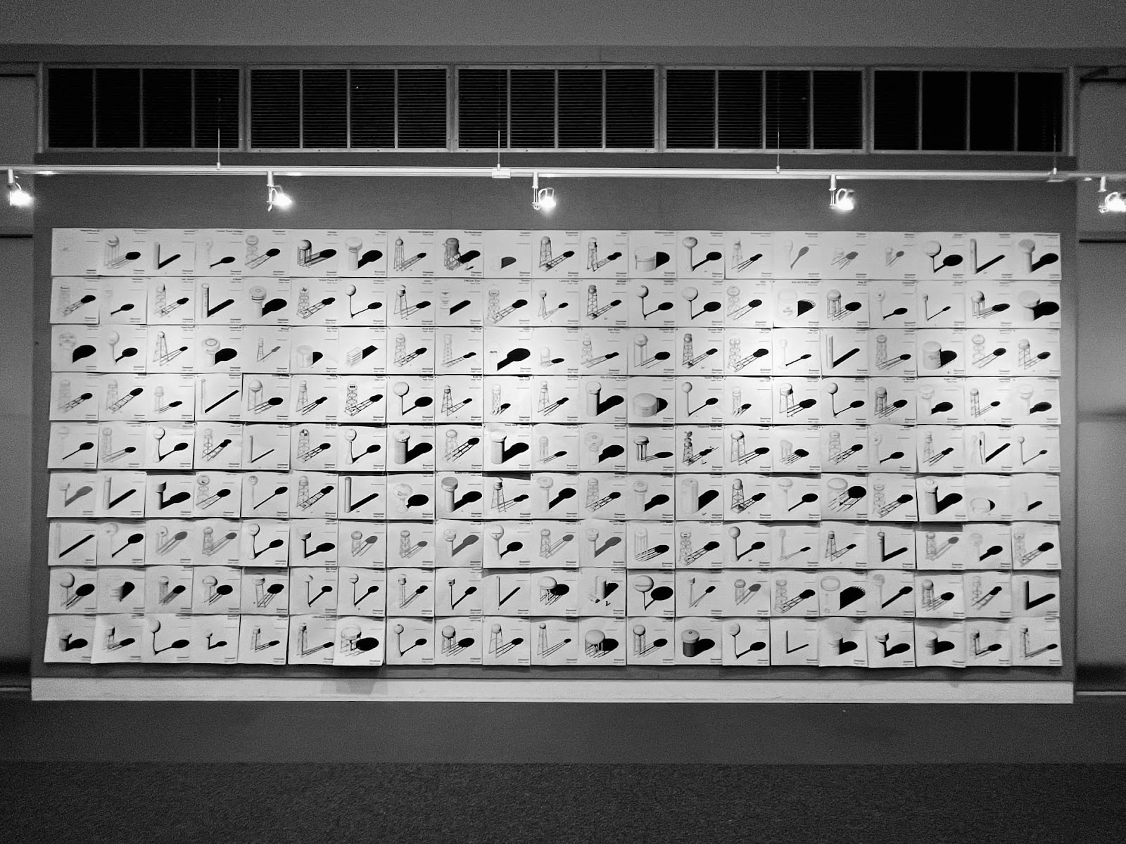 Studio presentation of the black and white drawings of water towers.