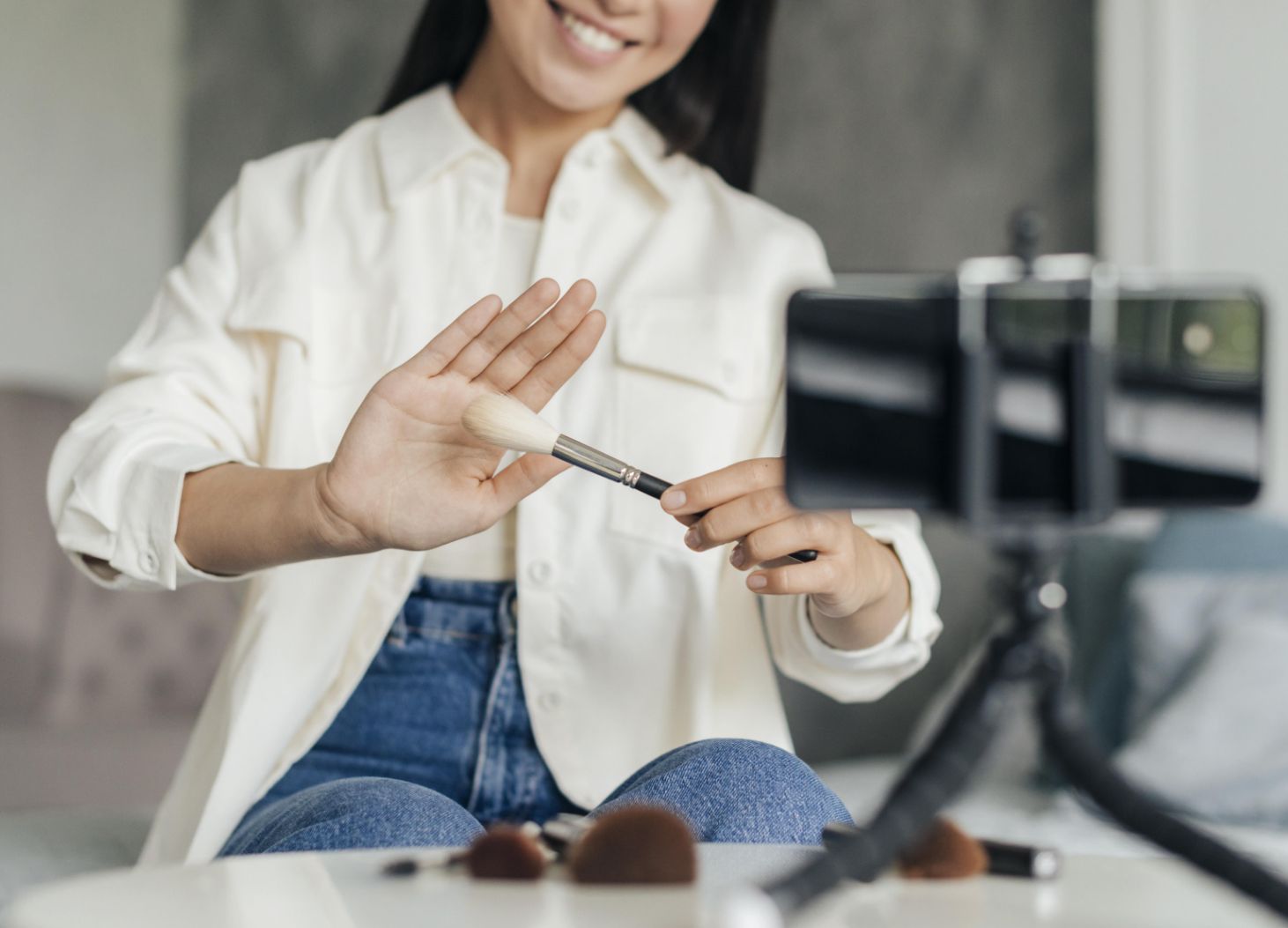 Customer creating user-generated content by recording a video of their purchased product